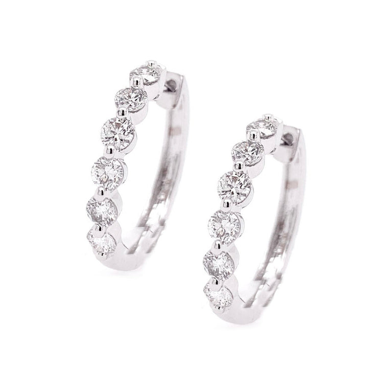 14K White Gold Single Prong Round Diamond Hoop Earrings. Bichsel Jewelry in Sedalia, MO. Shop online or in-store to find the perfect style today!
