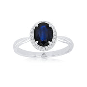 14K White Gold 1.45ct Oval Blue Sapphire Ring with Round Diamond Halo. Bichsel Jewelry in Sedalia, MO. Shop gemstone rings online or in-store today! Free ring sizing.