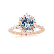 14K Rose Gold 1.15ct Round Aquamarine Ring with 0.49ct Diamond Halo. Bichsel Jewelry in Sedalia, MO. Shop gemstone rings online or in-store! Free ring sizing.
