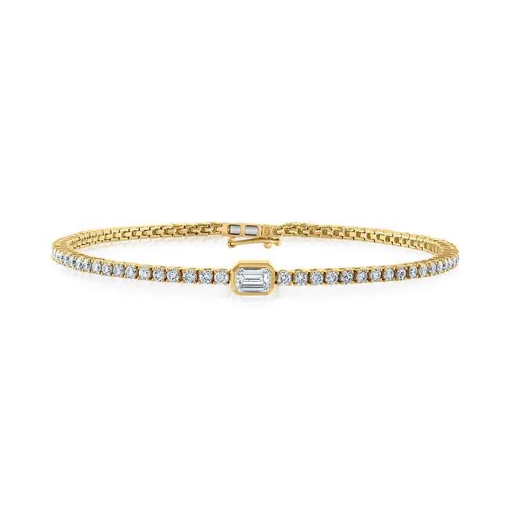 14K Yellow Gold 1.54ct Round Diamond Tennis Bracelet with Bezel-Set Emerald Cut Center Diamond. Bichsel Jewelry in Sedalia, MO. Shop diamond styles online or in-store today! 