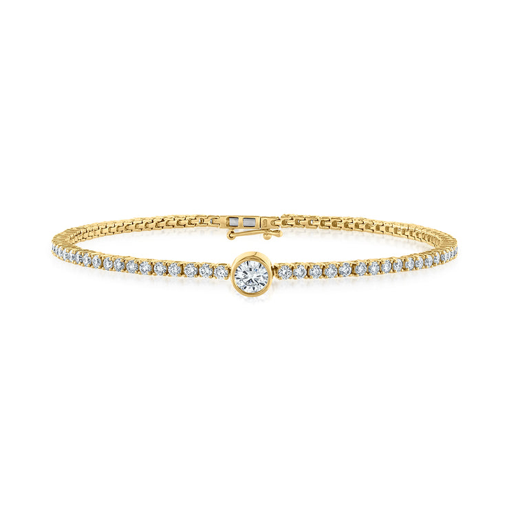 14K Yellow Gold 1.56ct Round Diamond Tennis Bracelet with Bezel-Set Round Center Diamond. Bichsel Jewelry in Sedalia, MO. Shop diamond styles online or in-store today! 