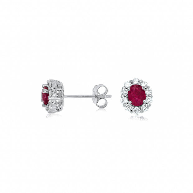 14K White Gold 0.80ct Oval Ruby Studs with Round Diamond Halos. Bichsel Jewelry in Sedalia, MO. Shop gemstone earrings online or in-store today!