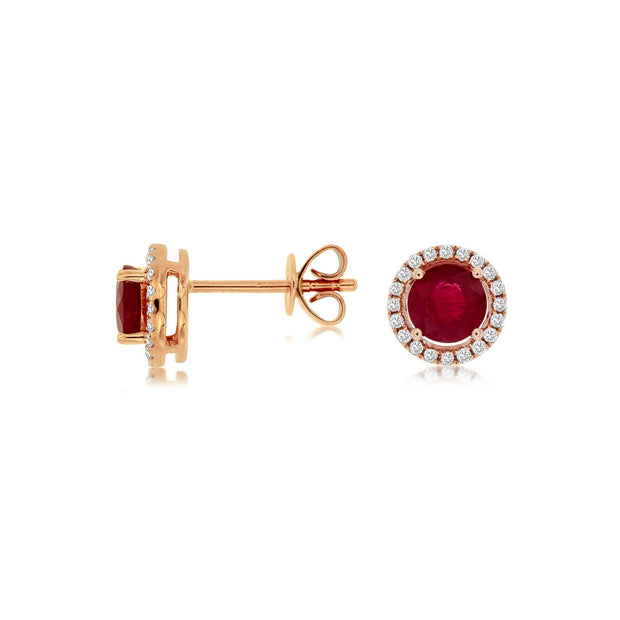 14K Rose Gold Round 0.94ct Ruby Stud Earrings with Diamond Halos. Bichsel Jewelry in Sedalia, MO. Shop gemstone earrings online or in-store today!