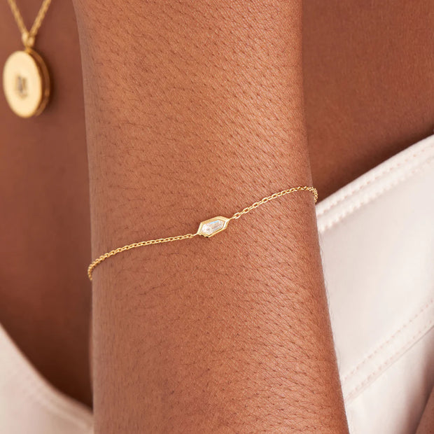 Ania Haie Gold Sparkle Emblem Dainty Chain Bracelet. 14K Yellow Gold plated on 925 Sterling Silver with CZ Stone. Bichsel Jewelry in Sedalia, MO. Shop online or in-store today!