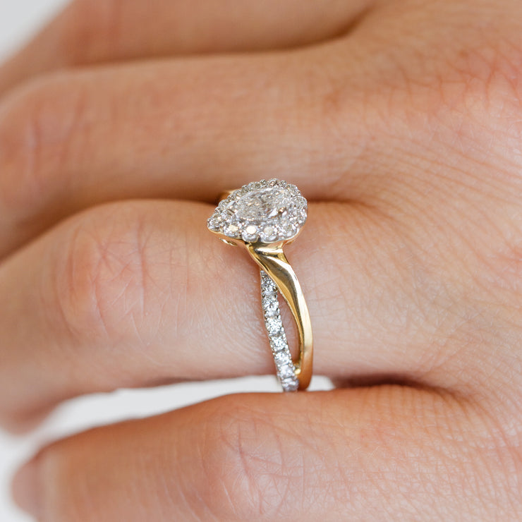 14K Yellow Gold Pear Diamond Engagement Ring with Halo & Twist Sides. Free Preferred Jewelers Warranty. Bichsel Jewelry in Sedalia, MO. Shop online or in-store today!