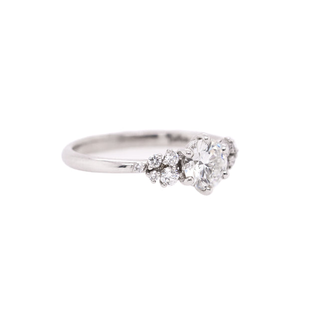 14K White Gold 0.80ct Round Diamond Engagement Ring with 0.16ct Cluster Accent Side Stones. Bichsel Jewelry in Sedalia, MO. Shop ring styles online or in-store today!