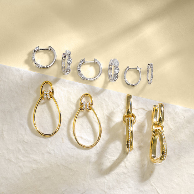 0.10ct Round Diamond-Accented 10K Yellow Gold Loop Earrings, Stud Backing. Bichsel Jewelry in Sedalia, MO. Shop earring styles online or in-store today!