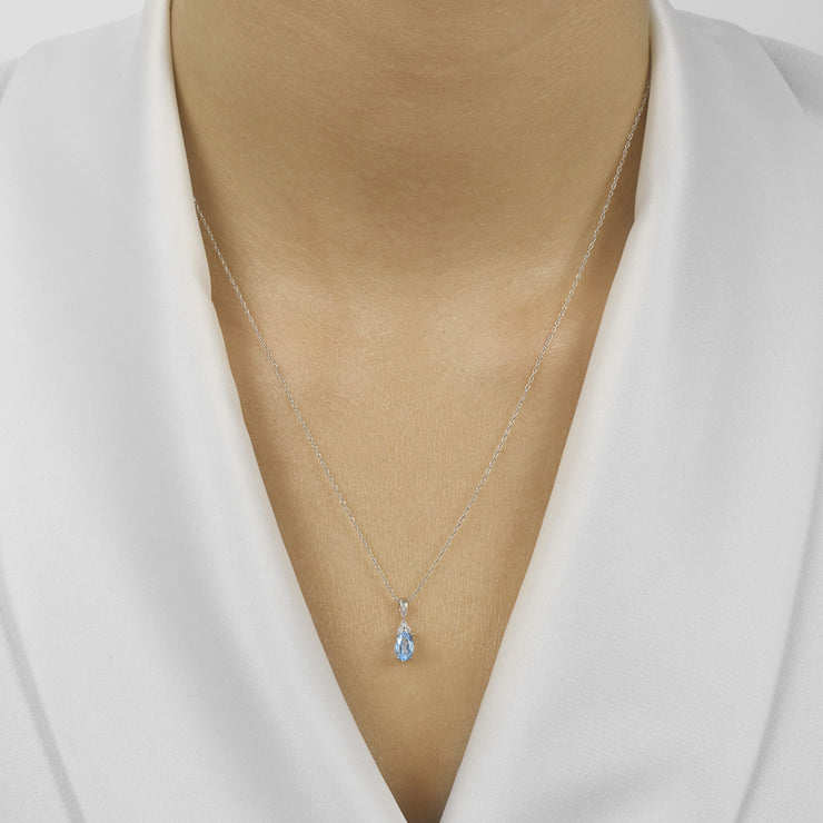 10K White Gold Oval 0.37ct Blue Topaz Necklace with Round Diamond Accents. Bichsel Jewelry in Sedalia, MO. Shop online or in-store today