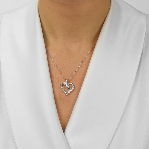 Sterling Silver Heart Shape Necklace with 0.02ct Round Diamonds. Bichsel Jewelry in Sedalia, MO. Shop styles online or in-store today!