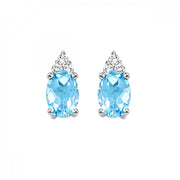 10K White Gold Oval 0.50ct Blue Topaz Stud Earrings with Round Diamond Accents. Bichsel Jewelry in Sedalia, MO. Shop online or in-store today!