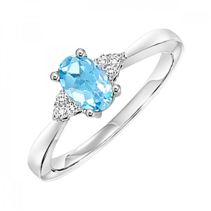 10K White Gold Oval Blue Topaz Ring with Round Diamond Accents. Bichsel Jewelry in Sedalia, MO. Shop online or in-store today!