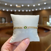 14K Yellow Gold Curb Chain Bracelet with 6mm Round Peridot Stone. Bichsel Jewelry in Sedalia, MO. Shop gemstone styles online or in-store today!