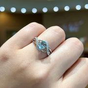 14K White Gold 0.67ct Oval Aquamarine Crossover Ring with Diamond Accents. Bichsel Jewelry in Sedalia, MO. Shop gemstone rings online or in-store!