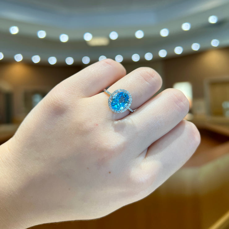 14K White Gold 3.20ct Oval Blue Topaz Ring with Diamond Halo & Side Diamonds. Bichsel Jewelry in Sedalia, MO. Shop gemstone rings online or in-store today!