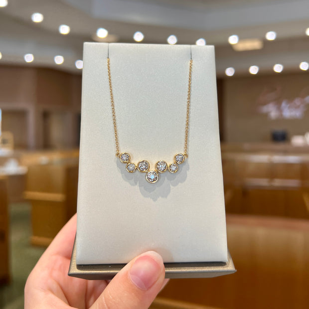 14K Yellow Gold Bezel-Set 0.50ct Round Diamond Cluster Necklace. Bichsel Jewelry in Sedalia, MO. Shop pendant styles online or in-store today!