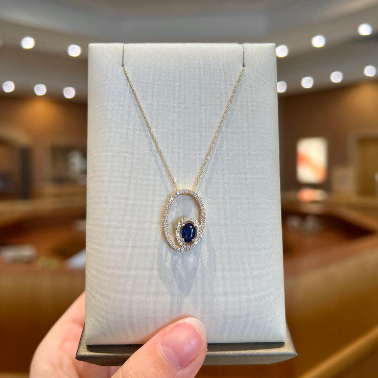 14K Yellow Gold 0.55ct Blue Sapphire Necklace with Diamond Halo. Bichsel Jewelry in Sedalia, MO. Shop gemstone styles online or in-store today!