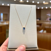 14K Yellow Gold Dainty 0.28ct Oval Blue Sapphire Necklace with Diamond Halo. Bichsel Jewelry in Sedalia, MO. Shop gemstone styles online or in-store today!