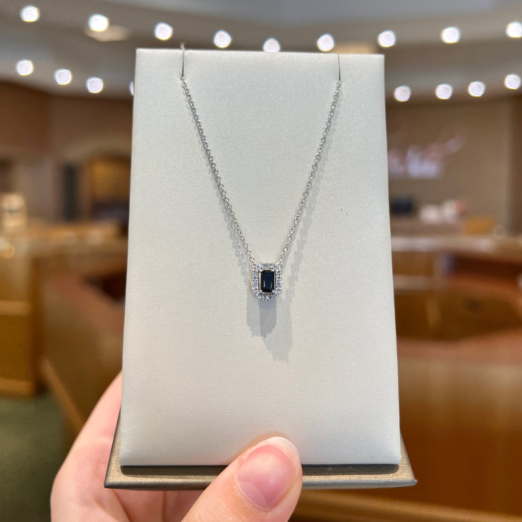 14K White Gold 0.37ct Emerald Cut Blue Sapphire Necklace with Round Diamond Halo. Bichsel Jewelry in Sedalia, MO. Shop online or in-store today!