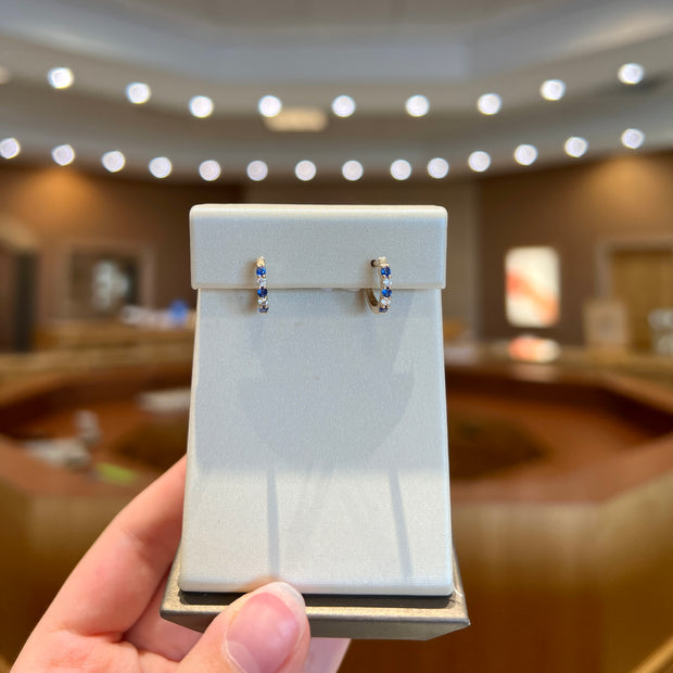 14K Yellow Gold Alternating Round Blue Sapphire & Diamond Hoops. Bichsel Jewelry in Sedalia, MO. Shop gemstone & diamond earrings online or in-store today!