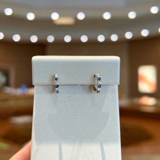 14K Yellow Gold Alternating Round Blue Sapphire & Diamond Hoops. Bichsel Jewelry in Sedalia, MO. Shop gemstone & diamond earrings online or in-store today!