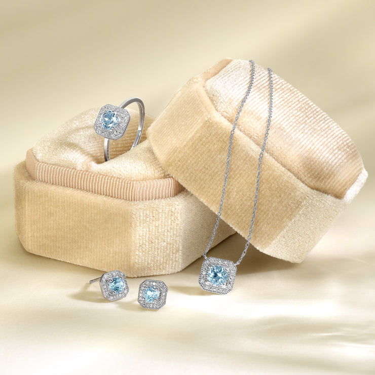10K White Gold 0.60ct Round Blue Topaz Necklace with Art Deco-Inspired Square Diamond Halo. Bichsel Jewelry in Sedalia, MO. Shop online or in-store today!