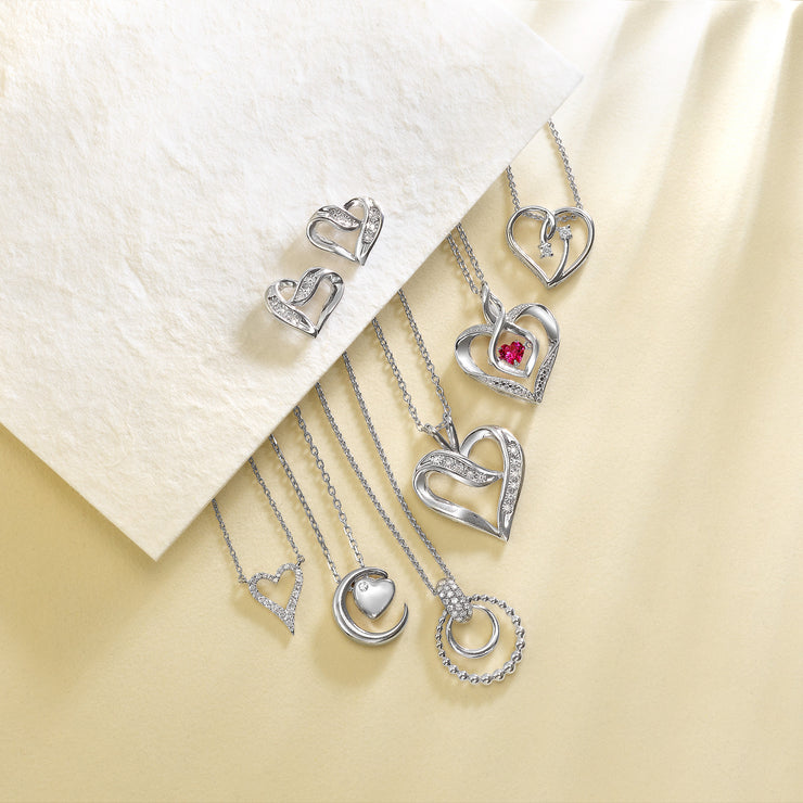 Sterling Silver Heart Shape Studs with 0.02ct Round Diamonds. Bichsel Jewelry in Sedalia, MO. Shop styles online or in-store today!