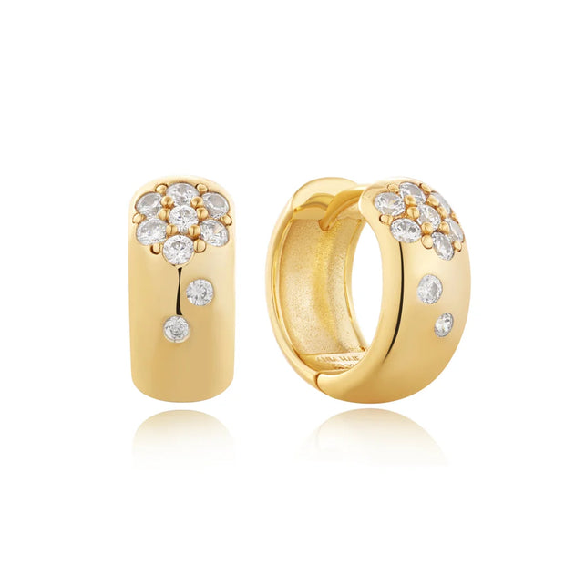 Ania Haie Gold Sparkle Huggie Hoop Earrings. 14K yellow gold plated on sterling silver with CZ stones. Bichsel Jewelry in Sedalia, MO. Shop hoops online or in-store today!