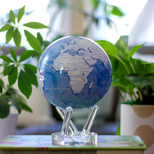 6" Sky Blue and White MOVA Globe with Acrylic Base. Powered by Solar Ambient Light & Magnets. No cords or batteries needed. Shop online or in-store today!
