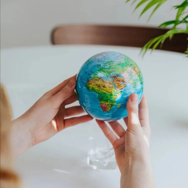 Blue Relief World Map 4.5" Globe with Acrylic Base. Powered by Solar Ambient Light & Magnets. No cords or batteries needed. Shop online or in-store today! Bichsel Jewelry | Sedalia, MO