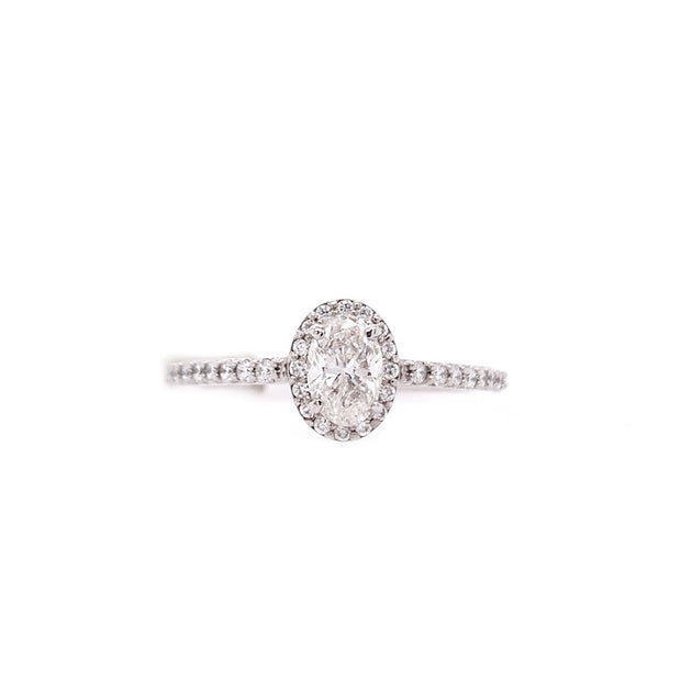 14K White Gold 0.50ct Oval Diamond Halo Engagement Ring with 0.25ct Side Diamonds. Bichsel Jewelry in Sedalia, MO. Shop online or in-store today!